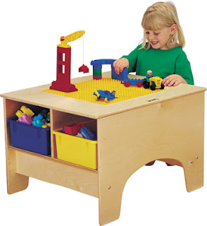 child's LEGO building table with storage bins