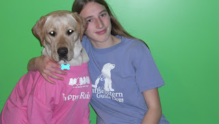 Picture of Toby & I, Toby is wearing my pink shirt which says puppy raiser, it has 7 cute puppies which say we are future guide dogs! I'm wearing the same shirt (but in blue, and you can see the front not the back), it says Southeastern Guide Dogs