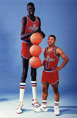 Manute Bol killed a lion with a spear. He paid 80 cows for his wife.  Tallest NBA player ever — blocked shots while standing. 👀, by Goodness  Akinola, Oct, 2023