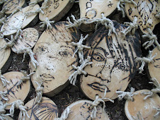 Etched faces in a "tree cozy"