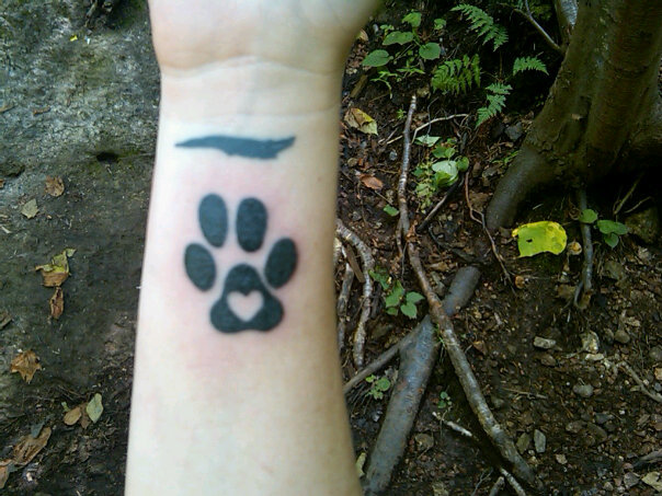to get a tribute tattoo of a scaled down version of his paw print with a