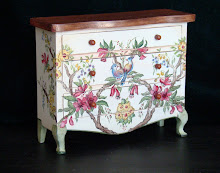 Country chest  of drawers painted with birds and flowers