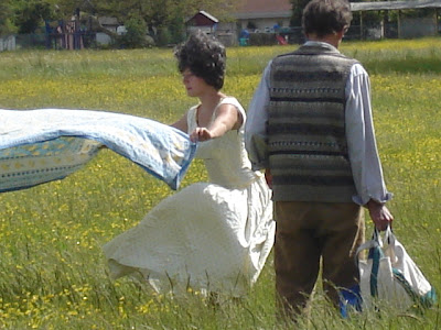 picnic prep in field of buttercups