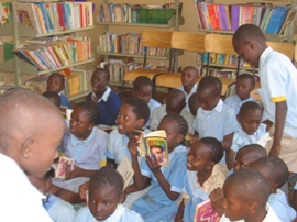 [Reading+the+new+donate+books+at+Olympic+Primary+in+their+library.JPG]