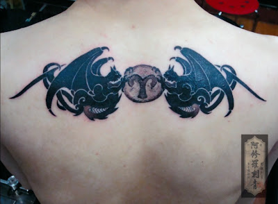 demon tattoo on the back