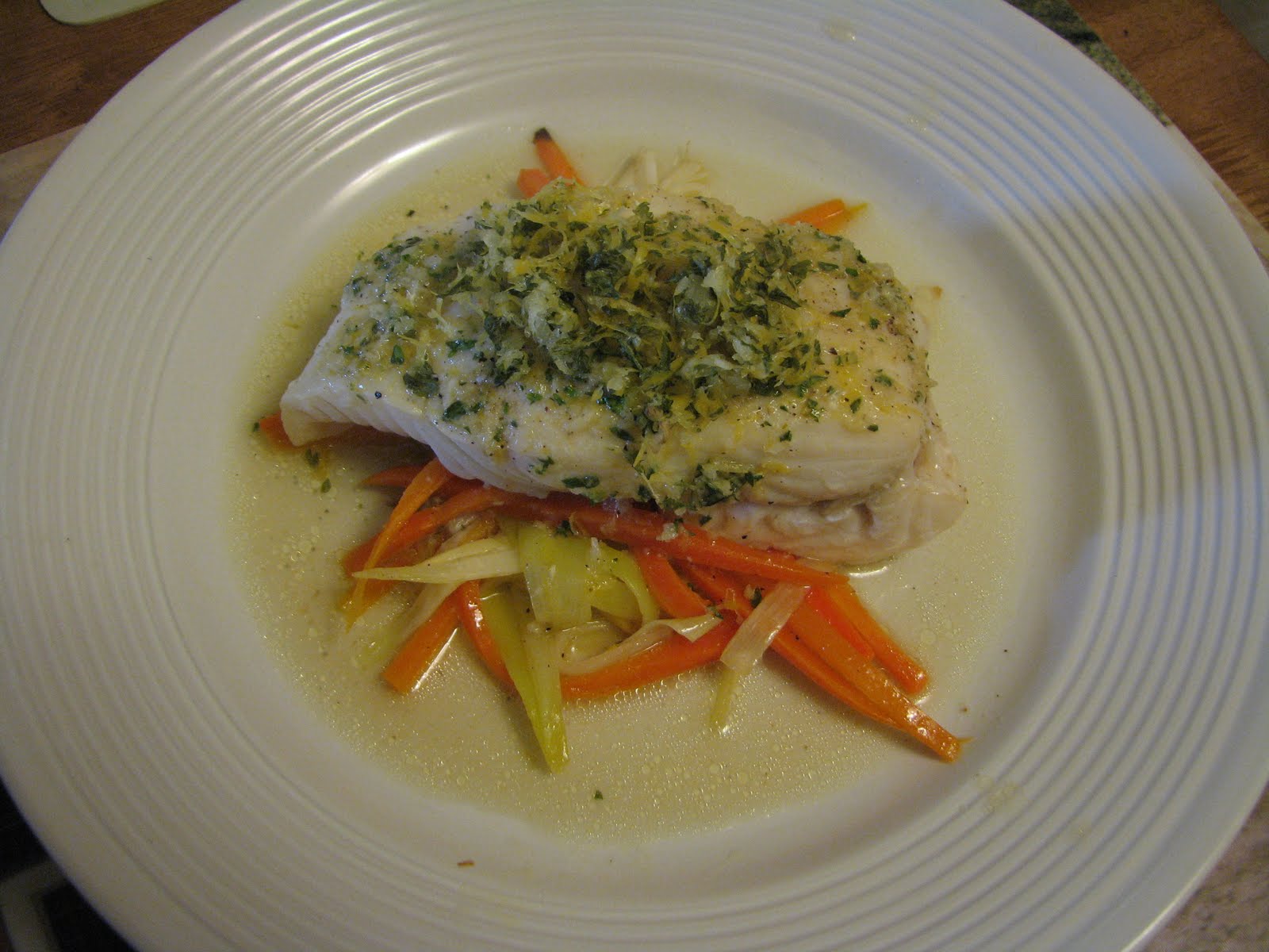 The Artichoke Halibut en Papillote with carrots and leeks.