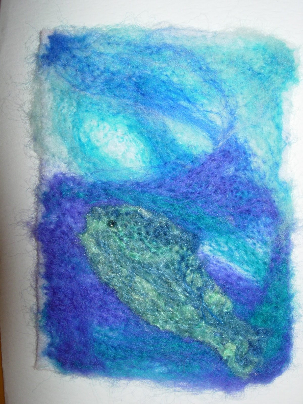 fish rising to the surface, felted on embellisher machine