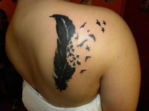 Ivory Rose: Tribal Feather tattoo