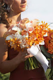 Pink roses, calla lillies with orange floral flower hand tied bouquet