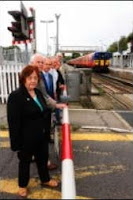 pic of people by level crossing