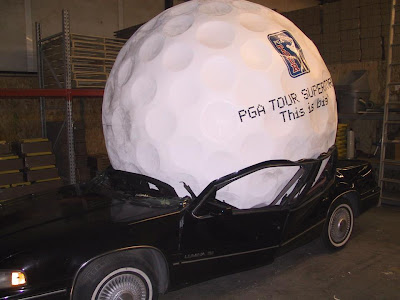 One giant golf ball crushed car or is Tiger Wood's career getting crushed under the weight of his giant ego?