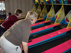 Grandmom and Margaret playing Skeeball
