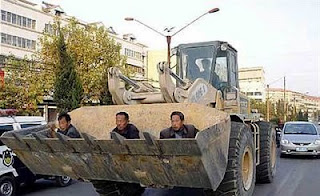 funny photos ride to work day in front of bulldozer
