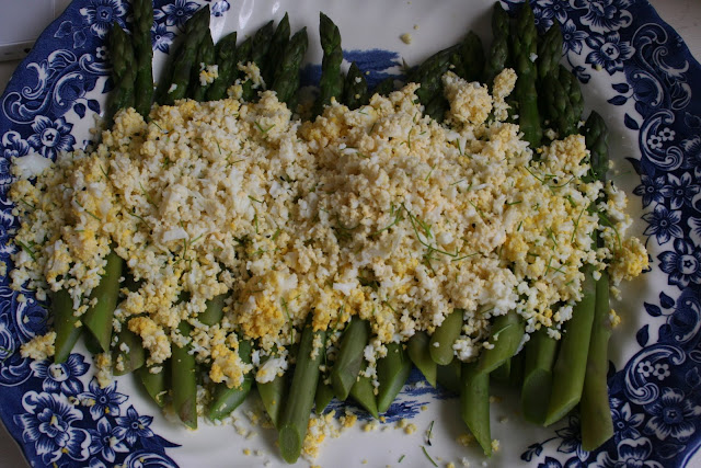 Asparagus mimosa, served with chives and sage butter, decorated with violas