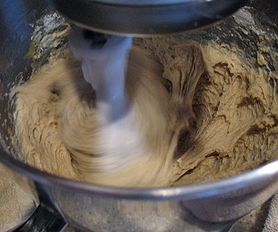 A close up photo of artos dough being mixed in a mixer.