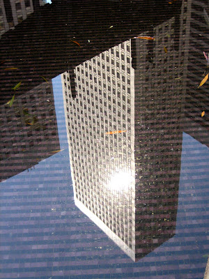photo of a reflection of a skyscraper in a pool in downtown San Francisco