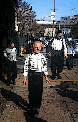 Boys walk on the street after school in Williamsburg, Brooklyn
