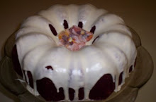 Homemade Red Velvet Bundt Cake with Cream Cheese Icing topped with sugared pansies