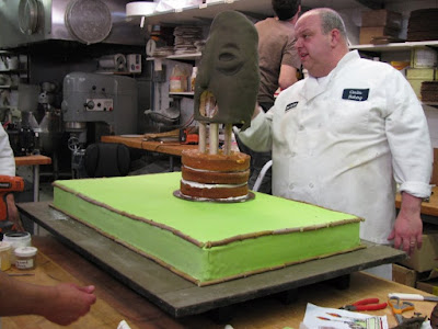 Cake Boss Tiki cake a blindfold a bikini and breathing fire Mauro Castano screencaps images bakery photos pictures screengrabs Libby Klein