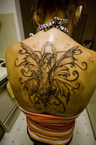 tattoo on back. Upper Back Fairy tattoo