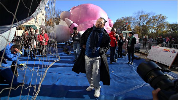 Japanese artist Murakami watched as balloons of his Kaikai and Kiki characters were readied for the parade. Nicole Bengiveno/The New York Times