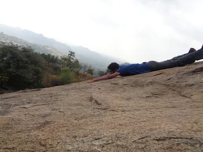 Rocky terrain and carved steps ascending the barren rock face of Huthridurga Hill