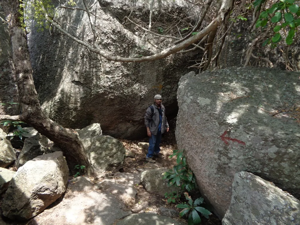 Savandurga Signage: A close-up photo of a directional or historical sign near the Savandurga base.